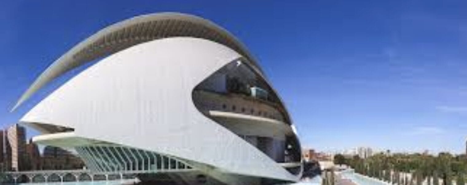 Palau de les Arts Reina Sofía Valencia modern opera house with futuristic white architecture and blue sky reflections